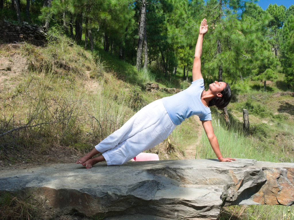 A woman performing Yoga in outdoor