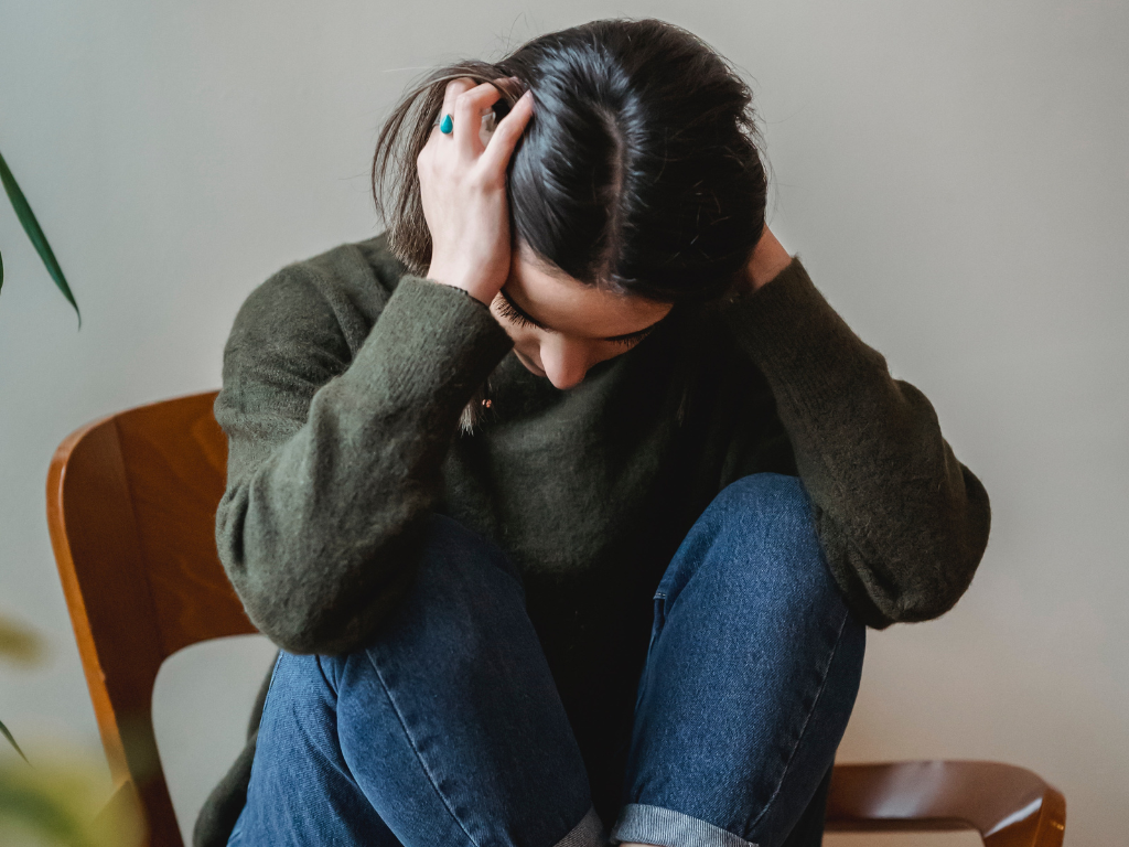 An image of a woman experiencing stress and anxiety