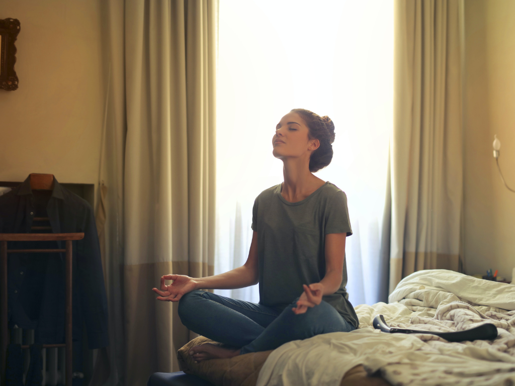 An image of a woman performing Heartfulness meditation