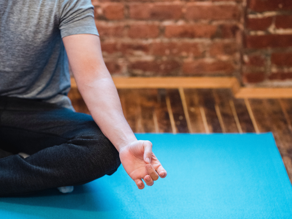 An image of a man performing Transcendental Meditation