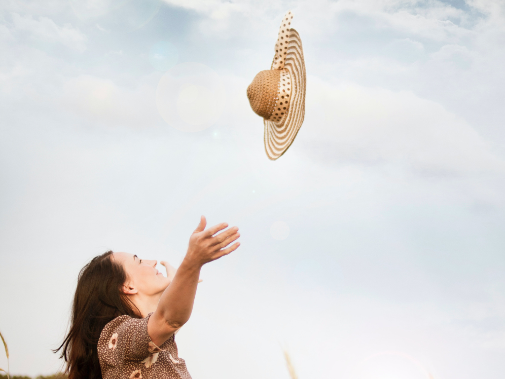 An image of a woman feeling the freedom