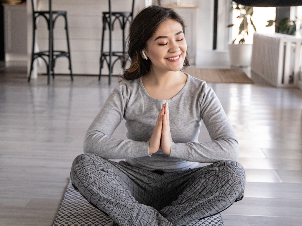 An image of a woman performing guided meditation