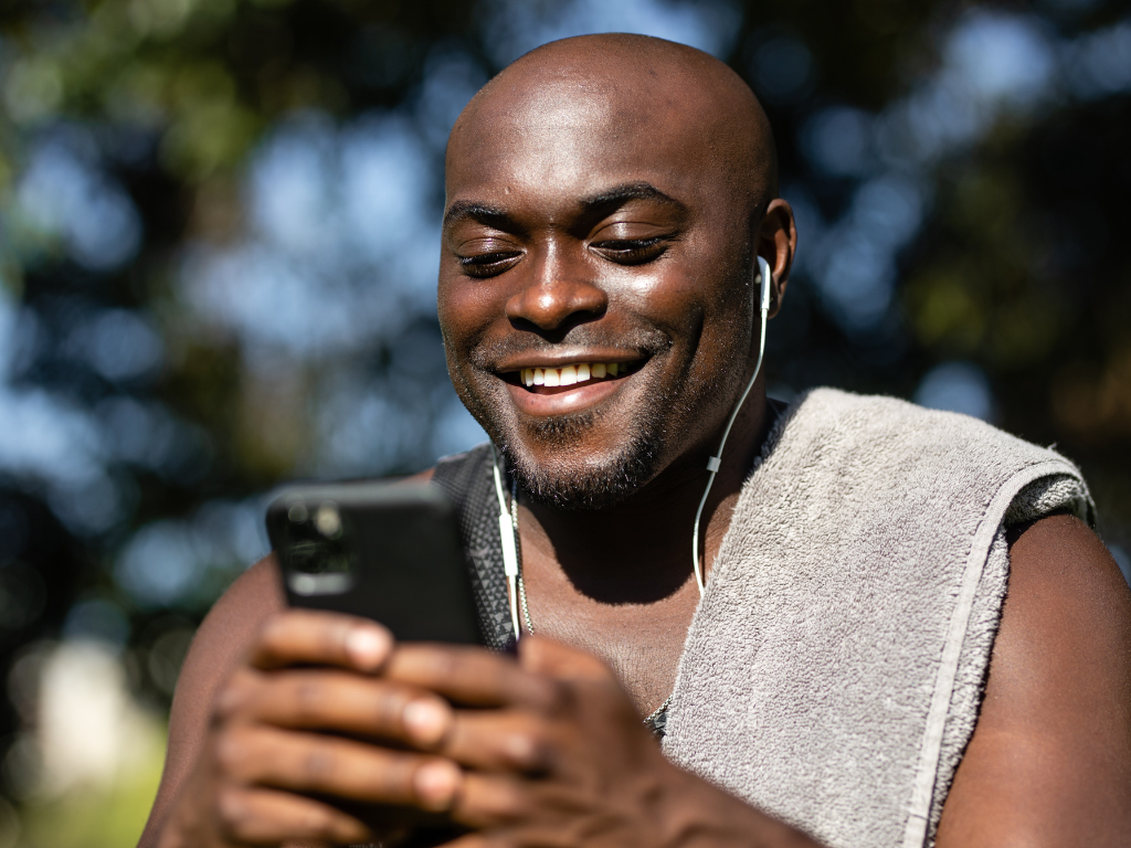 An image of a man into his phone depicting the digital era